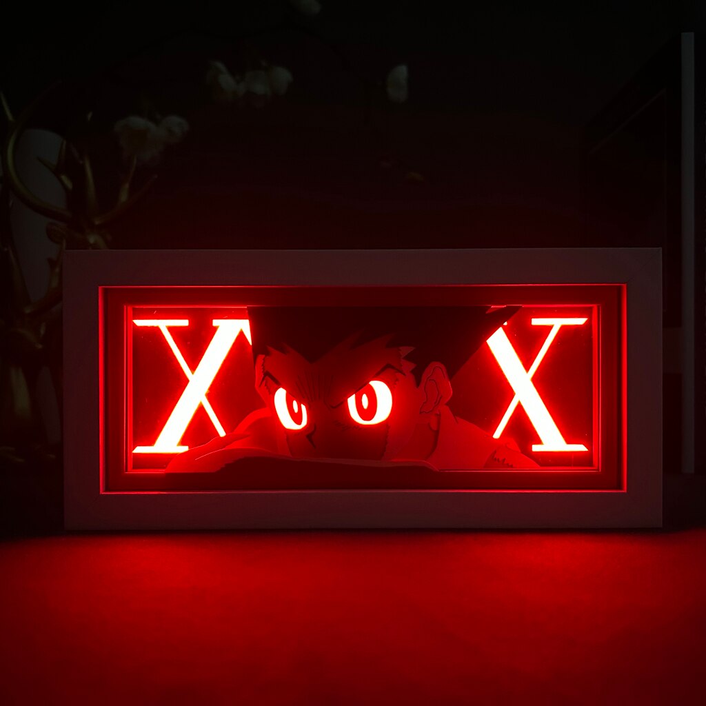 Layered cut paper lamp featuring Gon Freecss on red light setting