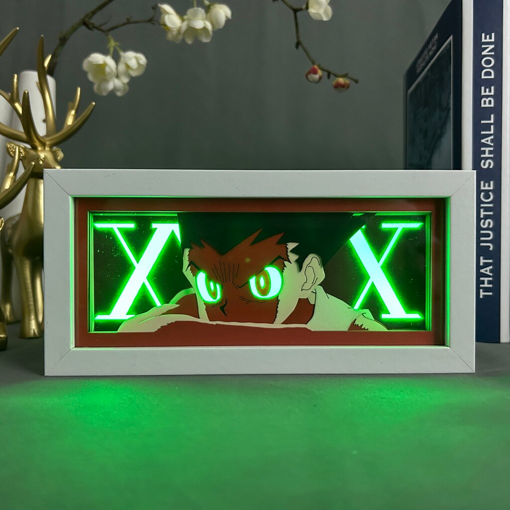 Layered cut paper lamp featuring Gon Freecss on green light setting