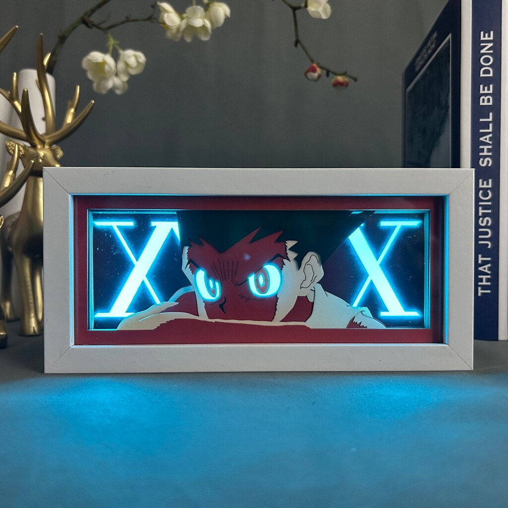 Layered cut paper lamp featuring Gon Freecss on blue light setting