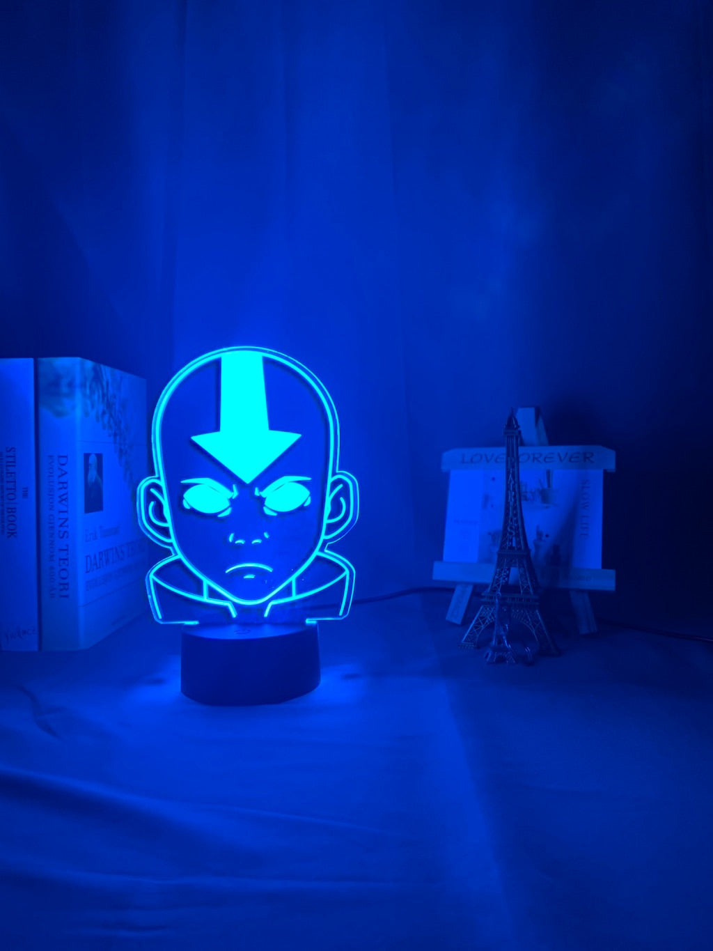 Acrylic Aang lamp on cyan light setting