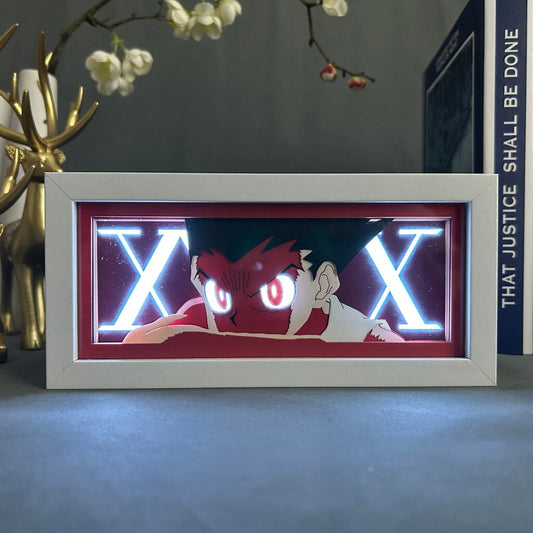 Layered cut paper lamp featuring Gon Freecss on white light setting