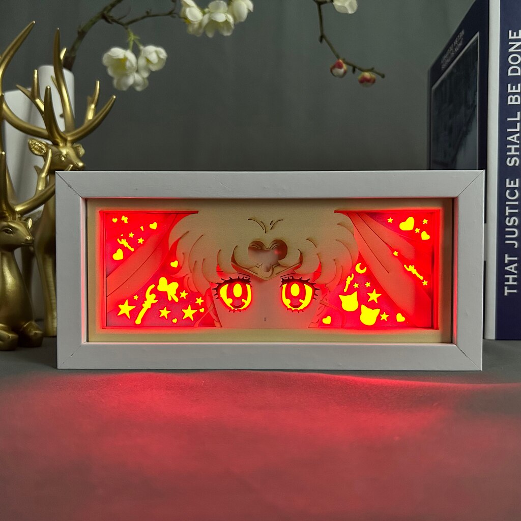Layered cut paper lamp featuring Usagi Tsukino on red light setting